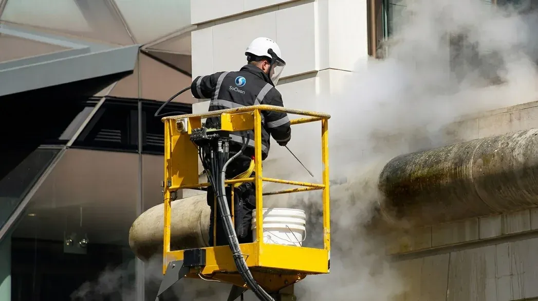 SoClean operative using the DOFF steam-cleaning system from an access platform
